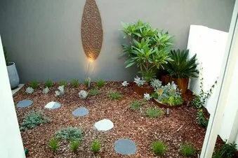 Landscaped Perth garden with manicured lawn and modern garden beds